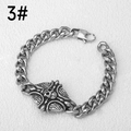 Detailed macro view of punk style stainless steel Cuban link bracelet with skull emblem - Standard Length / Skull Cross Style