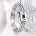 Detail view of silver stainless steel bracelet featuring a green stone and paved crystals - Silver Style (ZJ12124) / Silver