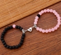 Close-up of magnetic heart clasp connecting pink and black beaded couple bracelets - Pink and Black Magnetic Style (ZJ12150)