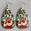 Close-up of teardrop leather earrings featuring cartoon reindeer and colorful lights - Christmas Lights Reindeer (7)