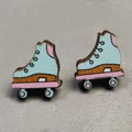 Macro detail of roller skate earrings featuring colorful printed wood on stone background - Blue Roller Skate Style (6)