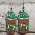 Creative coffee cup earrings featuring football print and green cream topping - American Football Cup Style