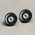Macro shot of circular wood grain stud earrings featuring a black number eight billiards design - Black 8 Billiard Style (9)
