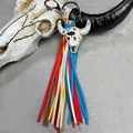 Macro detail of western bull head charm with rhinestones and multi-color leather tassels - Black and White Cow Print Bull Head (7)