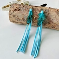 Bohemian tribal feather tassel earrings with blue suede fringe on rustic wood stand - Sky Blue