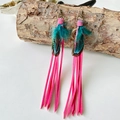 Detail of bohemian long tassel earrings featuring hot pink and teal feathers with leather - Hot Pink