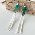 Detail of bohemian long feather earrings with peacock blue and white suede tassels - White