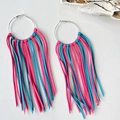 Bohemian large hoop earrings with pink and blue suede tassels on white background - Tiffany Blue