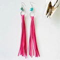 Detail of bohemian western earrings with pink suede tassels and blue turquoise stones - Rose Red