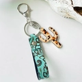 Bohemian leather keychain with turquoise embossed strap and leopard cactus charm pendant - Fuzzy Leopard Print (5)
