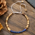 Macro view of adjustable woven bracelet with coconut wood beads and imperial stone - Wood Color With Lapis Blue Beaded Bracelet (ZJ13084)