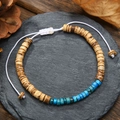 Detailed shot of handmade beaded bracelet with coconut shell wood and blue emperor stone - Wood Color With Bright Blue Stone Bracelet (ZJ13086)