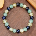 Bracciale elastico con perle di cristallo verdi, viola e gialle su fondo in legno - Stile Crepato Verde Chiaro Blu Viola (ZJ14540)