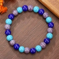 Elegante bracciale di perle di vetro blu e lilla su uno sfondo in legno naturale - Stile Vetro Tritono Blu Viola (ZJ14538)