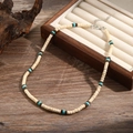 Bohemian beaded necklace with cream, brown, and turquoise beads on a wooden background - Beige and Brown Wood Bead Turquoise Style (ZJ11064)
