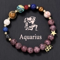 Detailed macro view of Aquarius zodiac bracelet with natural stone beads and gold charms - Aquarius