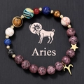 Detailed shot of Aries natural stone beaded bracelet with cosmic star and planet charms - Aries