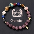 Close-up of Gemini beaded bracelet with natural stones and golden constellation charms - Gemini