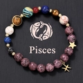 Detailed macro view of Pisces natural stone beaded bracelet with zodiac and star charms - Pisces