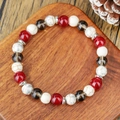 Flat lay of beaded bracelet with tiger eye and imperial stones on a wooden stand - Red Agate White Turquoise And Smoky Quartz Mixed Style (ZJ15799)
