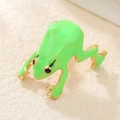 Detailed close-up of a green enamel tree frog ring with gold accents and black eyes - Frog Shape / Bright Green (ZJ14852)