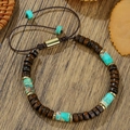 Boheems gevlochten armband met donkere houten kralen, turquoise stenen en gouden accenten - ZJ15000-Donkerbruin Hout Turkoois Vierkant Goud Afstandhouder Armband