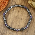 Close-up of hematite beaded bracelet with purple crystals on a natural wooden background - Purple Crystal Patchwork Style (ZJ15026)