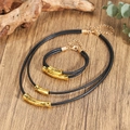 Detail of layered black cord necklaces and bracelet set with gold tubular metal slides - Black Rope Gold Tube Slider 3-Piece Set (ZJ16247)