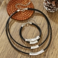 Black cord necklace and bracelet set with silver tube accents on a wooden background - Black Double-Strand Rope Minimalist Set (ZJ15070)