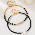 Set de pulseras estilo bohemio con cuentas de cobre doradas, cristales negros y perla - Estilo Capas Perla Negro Dorado (ZJ15646)