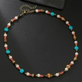 Collier bohème pour hommes en noix de coco avec perles turquoise et rouges sur pierre - Style Perlé Mixte Turquoise en Cinq Couleurs (ZJ15696)