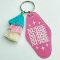 Detail of pink acrylic nurse keychain with three-layer tassel and retro lettering - Nurse Repeating Text Style / Teal Pink Beige Gradient Tassel
