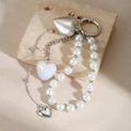 Metallic heart and imitation pearl keychain with silver spring clasp on stone background - Pearl Heart Hook Style (ZJ15973)