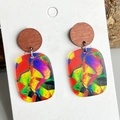 Close-up of colorful floral acrylic earrings with retro wooden studs on a white card - Mahogany Wood Geometric Pattern Style (9)