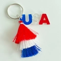 Detail of USA glitter charms and patriotic red white blue tassels on the metal keychain - USA Letter Pattern (5)