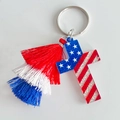 Macro shot of patriotic cross pendant keychain with red white and blue tassels - Cross Pattern (3)