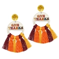 Detail of wooden Give Thanks earrings with autumn colored cotton tassels and glitter studs - Give Thanks Round with Tricolor Tassel / 2