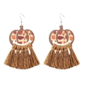 Detail of bohemian pumpkin wood earrings with coffee cotton tassels and autumn leaf patterns - 6