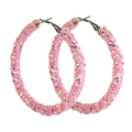 Macro detail of pink glitter hoop earrings featuring sparkling textured surface and silver clasp - Pink