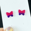 Sparkly purple butterfly stud earrings with pink glitter on a white display card - Butterfly Design (1)