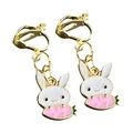 Macro shot of cute white rabbit clip-on earrings with pink accents and golden U-clips - Bunny With Pink Tail (3)