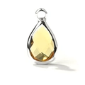 Detailed view of teardrop yellow crystal pendant with faceted glass and silver-tone bezel - Silver Border February (P2298)