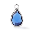 Macro shot of a teardrop-shaped blue faceted gemstone pendant with a silver metal frame - Silver Border March (P2299)