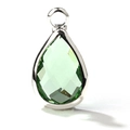 Macro detail of a pear-cut light green glass gemstone pendant with silver-plated bezel - Silver Border November (P2302)