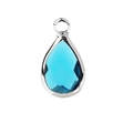 Close-up of a blue teardrop faceted gemstone pendant with silver metal bezel and ring - Silver Border January (P2292)