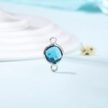 Macro shot of a double-loop round birthstone connector in deep blue crystal with silver trim - Diameter 8mm / 10 Pieces Pack / Silver Edge-December (P2317)