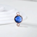Detail of rose gold double-loop connector with faceted blue birthstone crystal for DIY jewelry - Diameter 8mm / 10 Pieces Pack / Rose Gold Edge-September (P2405)
