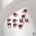 Close-up of faceted purple glass birthstone charms with rose gold copper plating for DIY - Rose Gold February (P2444)
