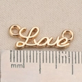 Macro shot of gold-plated Love connector charm with measuring ruler for DIY jewelry - Love Letter Style (P1609)