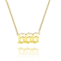 Macro detail of gold-plated stainless steel necklace with 666 angel number pendant - Style 666 / Gold